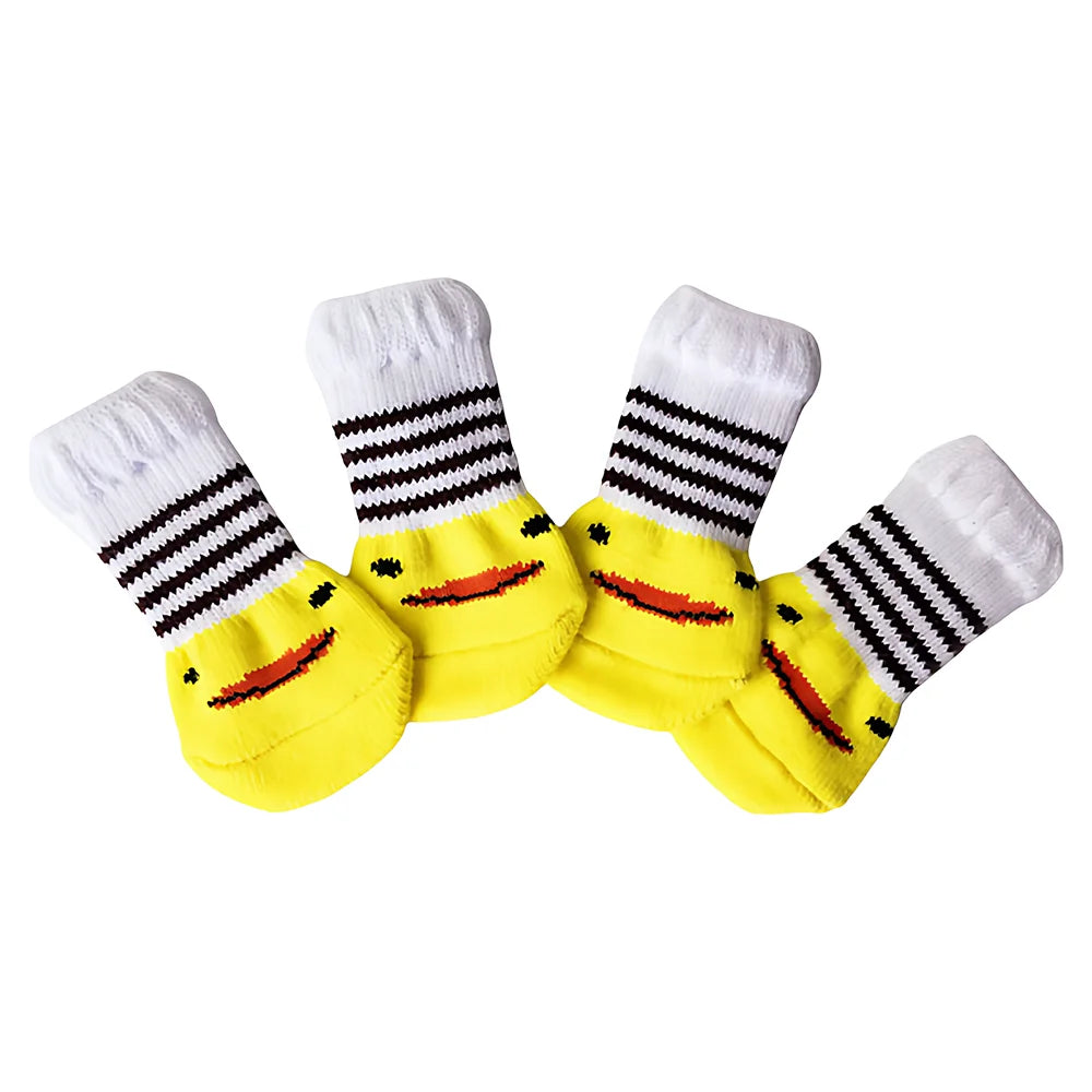 A pack of four yellow and white striped anti-scratch cotton pet socks for small dogs and cats.