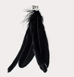 A black suction cup cat teaser wand with a replaceable feather toy.