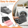 Gray foam pet stairs with a black cover being washed in a white washing machine.