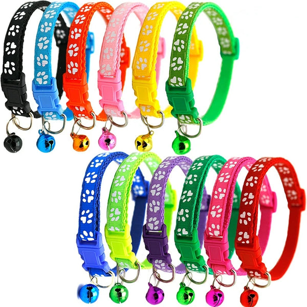 A variety of adjustable cartoon footprint pet collars in various colors and patterns displayed on a white background.