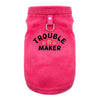 A bright pink, fuzzy pet jacket for dogs with a metal clasp.