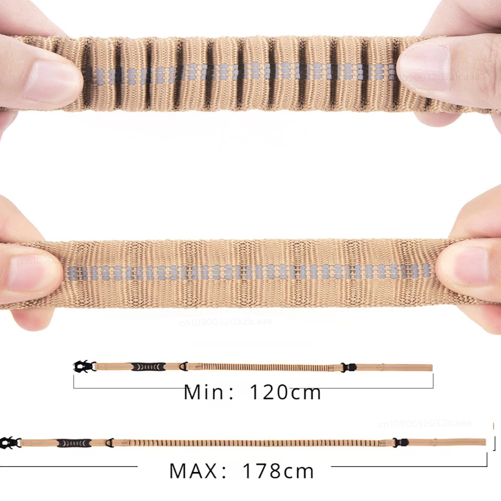 A close-up of a tan reflective bungee dog leash showing its length options and texture.
