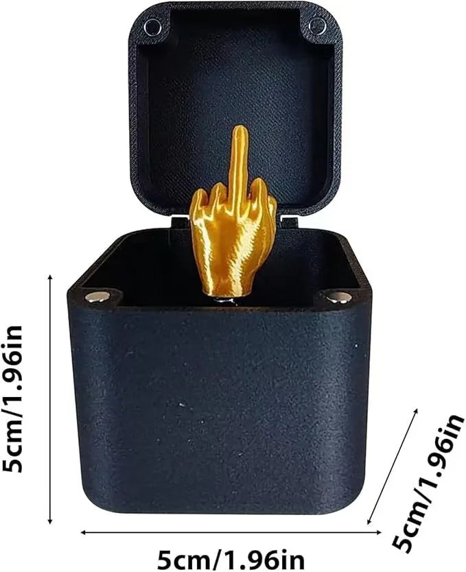 A black wooden box with a lid open, revealing a golden hand figure.