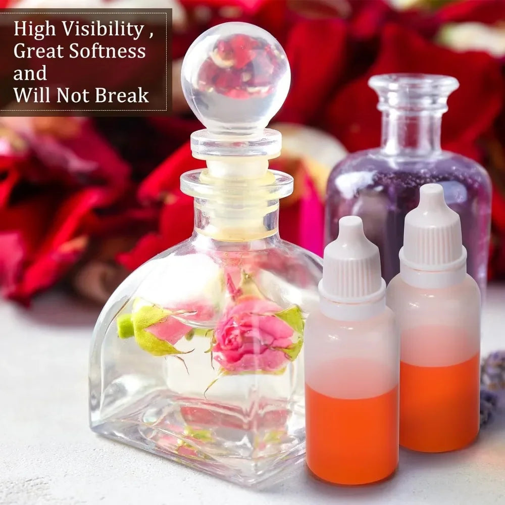 Glass dropper bottles containing pink and orange liquid for precision liquid droppers