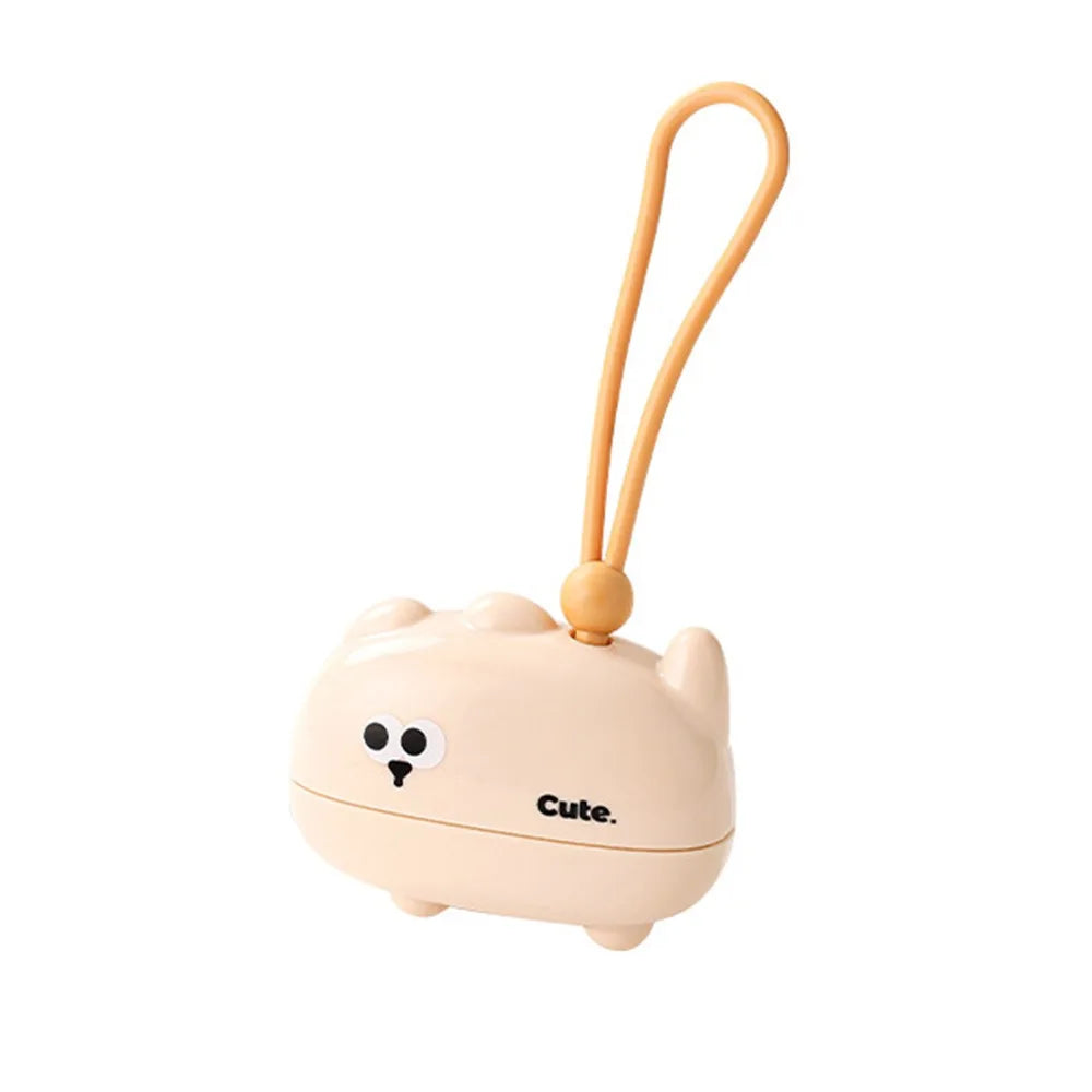 A beige reusable pet hair roller with a cute elephant face design and a flexible handle.