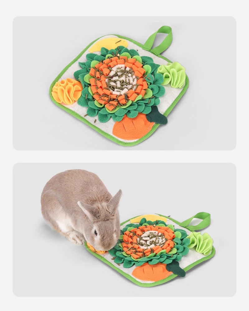 A green mat with an orange flower design and a green handle, featuring a small rabbit.