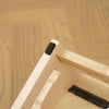 Close-up view of solid wood pet stairs with non-slip steps showing the wooden structure and dark felt grips.