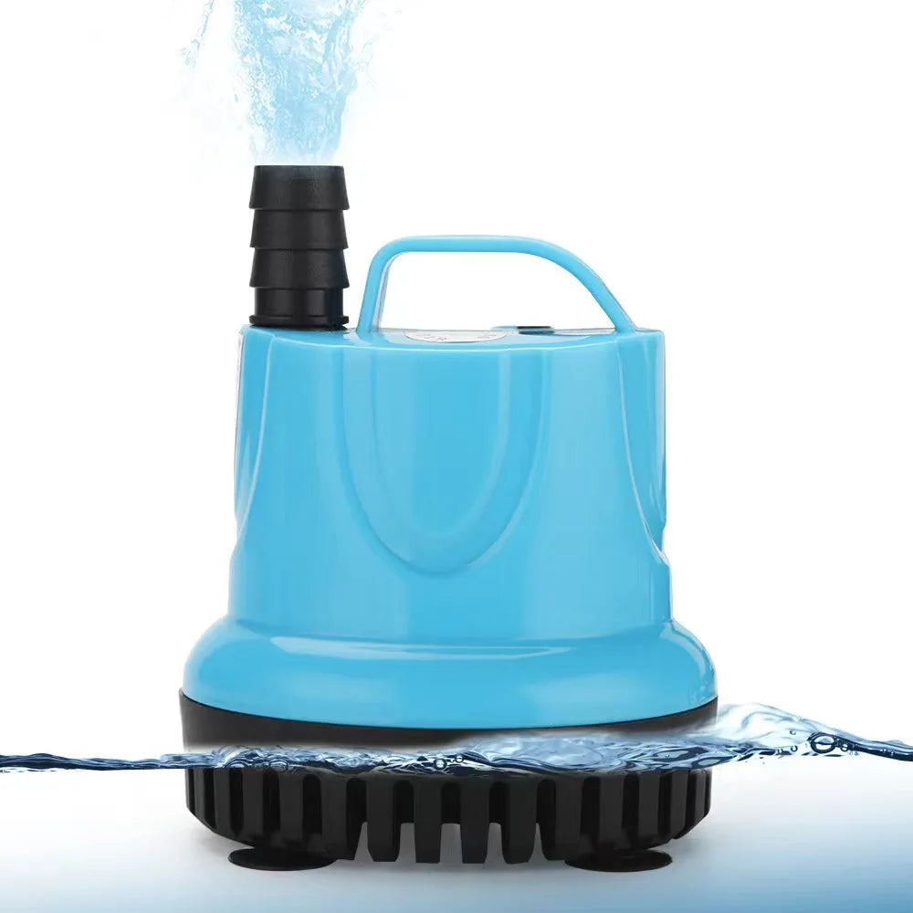 A blue submersible aquarium water pump is shown with water flowing out from the nozzle onto a surface.