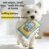 A white dog is sniffing a blue fabric puzzle toy designed for training and physical exercise.
