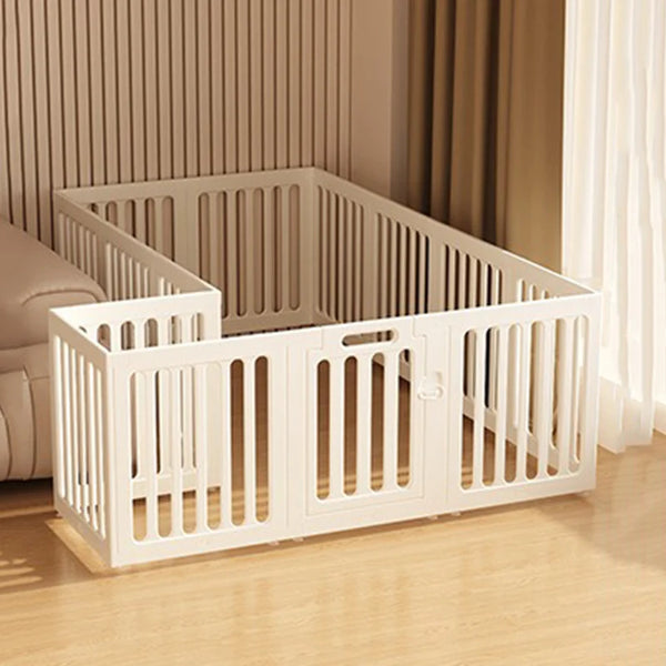 A white heavy duty pet fence cage with suction cups is shown in a room setting.
