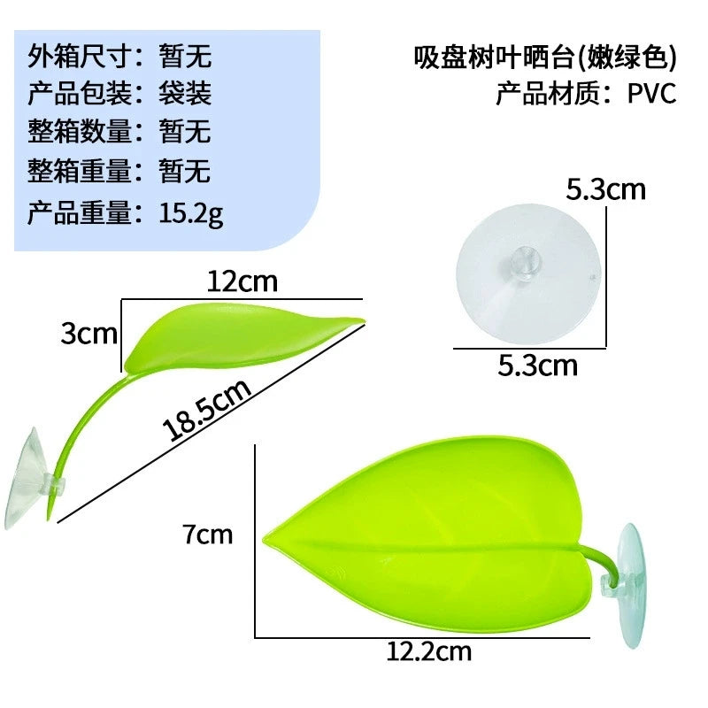 A bright lime green basking platform for reptiles featuring a leaf-shaped design and a suction cup mount.