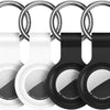A silicone airtag protective cover with a keychain is shown in white and black.