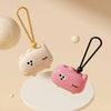 A pink reusable pet hair roller with a cute animal design and a gold-colored handle is shown on a white surface.