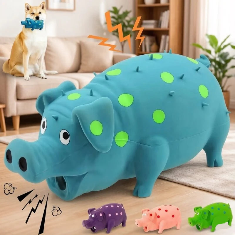 A large blue pig squeaky toy is shown next to a dog and other small plastic toys.