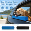 Blue and black EVA foam chin support pad for dogs placed on a car window.