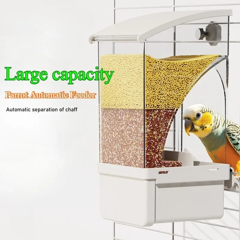 A white automatic parrot feeder with three compartments for separating chaff, seeds, and grains.