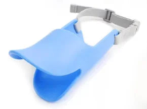 A light blue silicone duckbill dog muzzle with a gray adjustable strap.