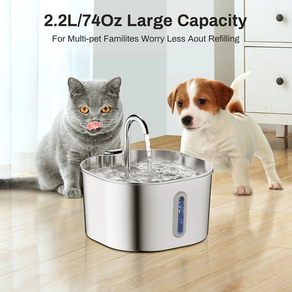 A stainless steel automatic pet water fountain is shown with water flowing, next to a cat and a dog.