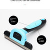 A black and light blue detachable pet hair grooming comb with a metal comb attachment.