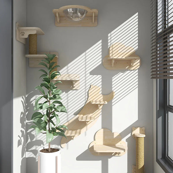 Wall-mounted wooden cat climbing shelf and hammock displayed on a white wall with shadows.