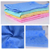 Stack of colorful ultra-absorbent dog bath towels in various shades of blue, yellow, and pink.