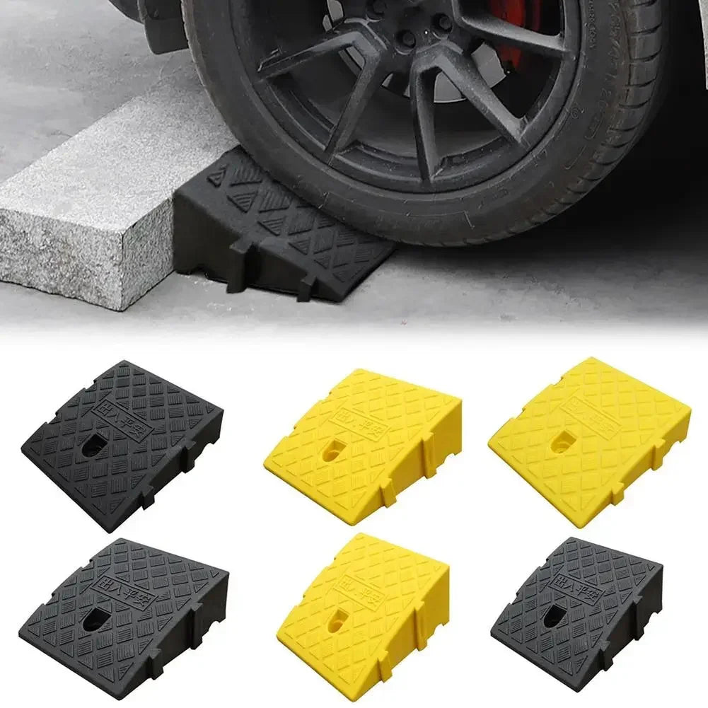 Set of black and yellow portable car driveway ramps for vehicle access