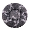 A round, gray plush pet bed with a striped pattern for dogs and cats.