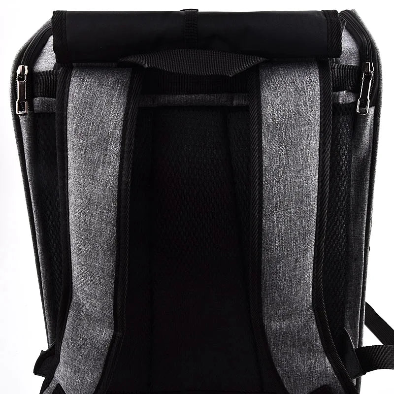 Black ventilated bird travel backpack featuring a perch and feeding cups.