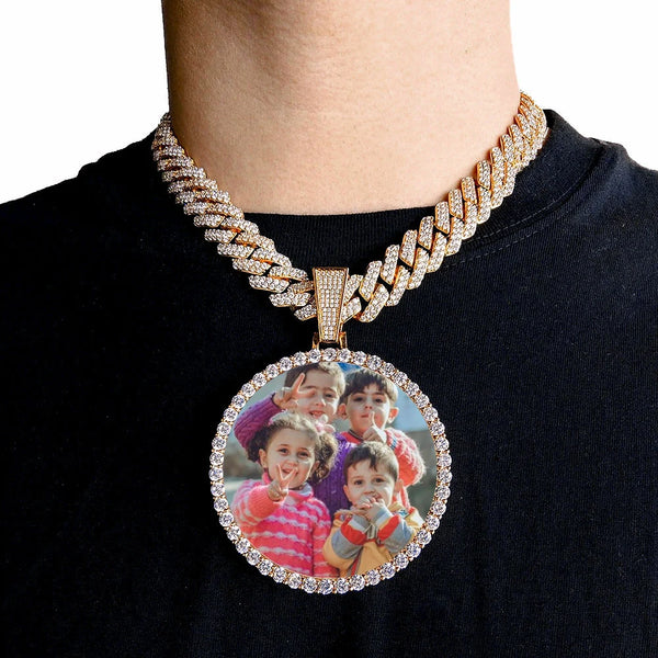 A gold-finished chain necklace with a round pendant featuring a photo of a family.
