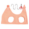 A pink pet nail trimming hammock for cats with metal clips and scissors shown against a white background.
