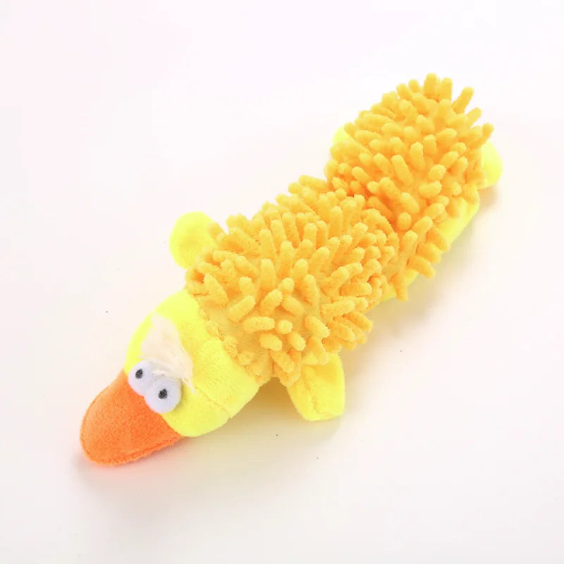 A bright yellow squeaky plush toy resembling a bird with orange beak and textured feathers.