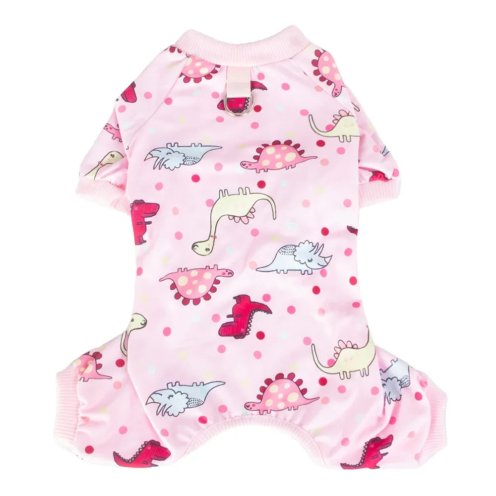 Pink soft cotton dog pajamas featuring a pattern of various dinosaur and animal figures