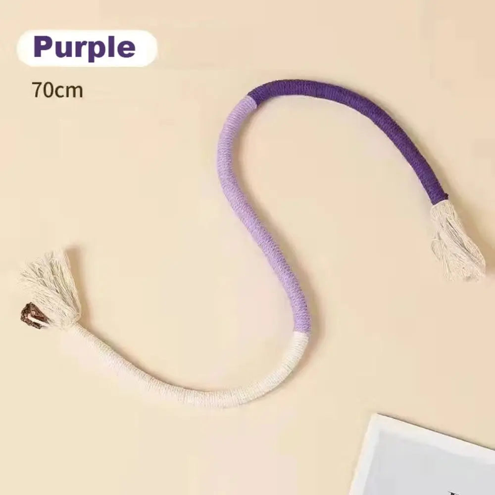 Purple cotton rope cat teaser toy with a tassel shown against a light background.