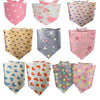 A collection of cute cotton pet bandanas for dogs and cats in various pastel colors and patterns.