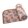 A rolled waterproof dog blanket with a soft, fuzzy texture and blue paw print pattern.