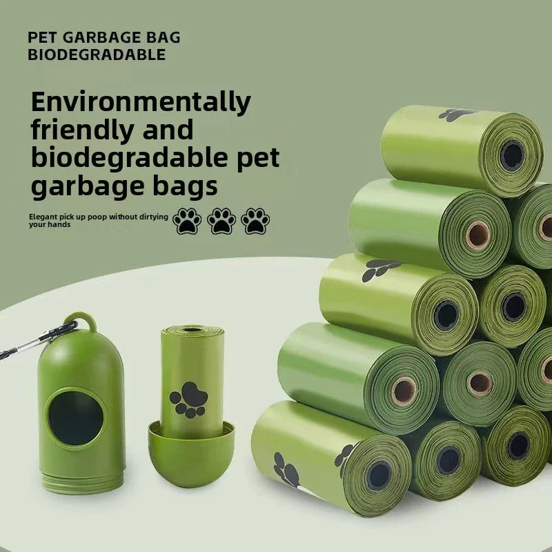 A stack of green biodegradable pet garbage bags and a dispenser are shown on a light background.
