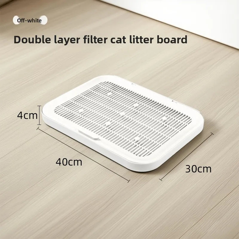 A white double layer filter cat litter board with anti-slip base shown on a wooden floor.