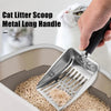 A hand is using a stainless steel cat litter scoop with a long handle to scoop litter from a container.