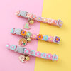 Buntes Tierhalsband mit Sicherheitsglocke für Hunde und Kätzchen, mit rosa, lila und orangefarbenen Blumenperlen.