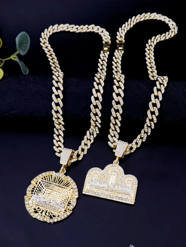 A pair of 14K gold plated last supper medallion pendant necklaces displayed against a dark background.