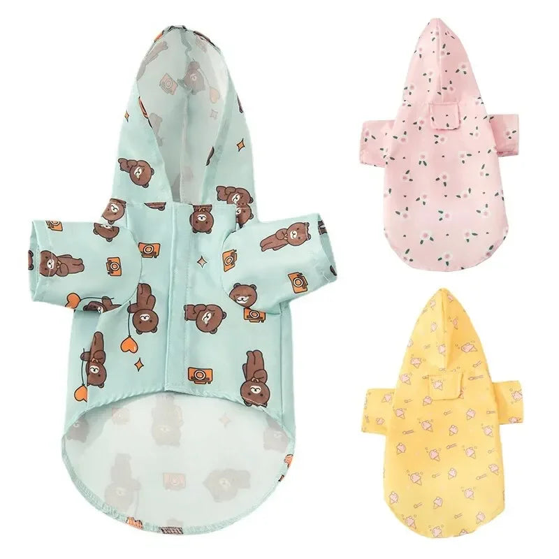 A pink waterproof summer raincoat for dogs with brown bear patterns.
