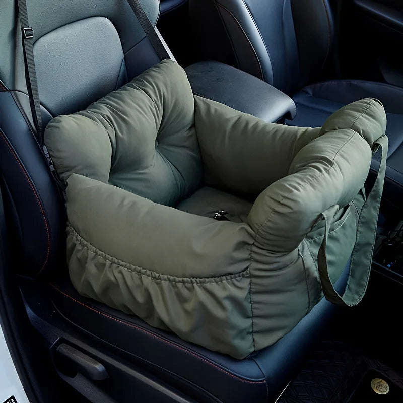 A green durable pet car seat with safety straps is shown installed in a dark car interior.