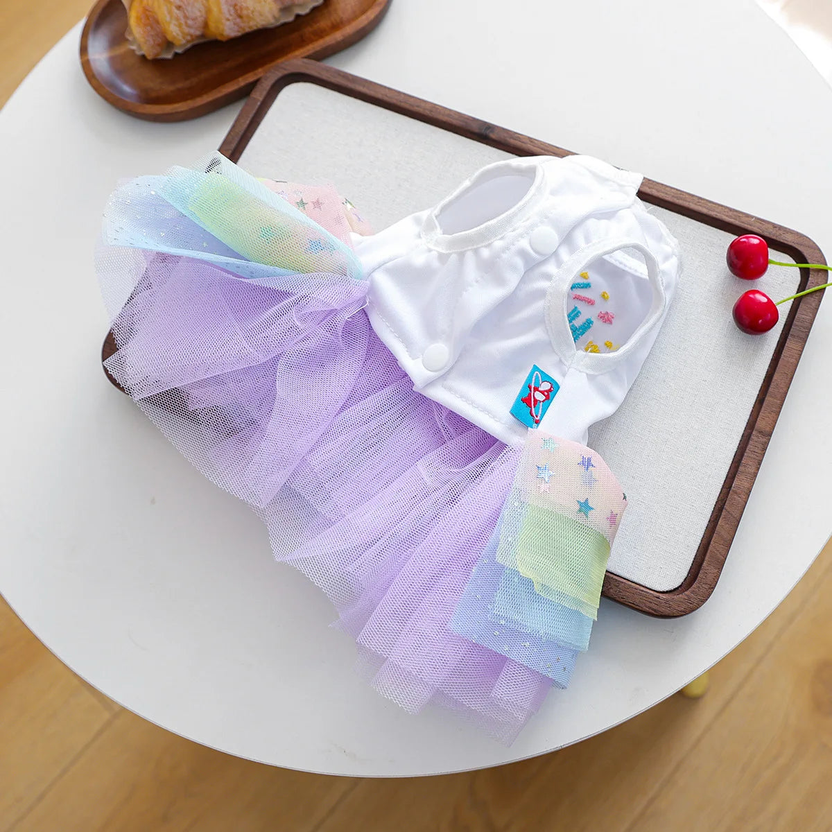 Elegant birthday suit for dogs featuring white tulle and pastel colored fabric