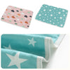 Two reusable absorbent pee pads for small pet cages featuring floral and star patterns in pink, green, and teal.