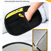 Black pet hair remover gloves with dual bristles shown next to a gray fabric surface