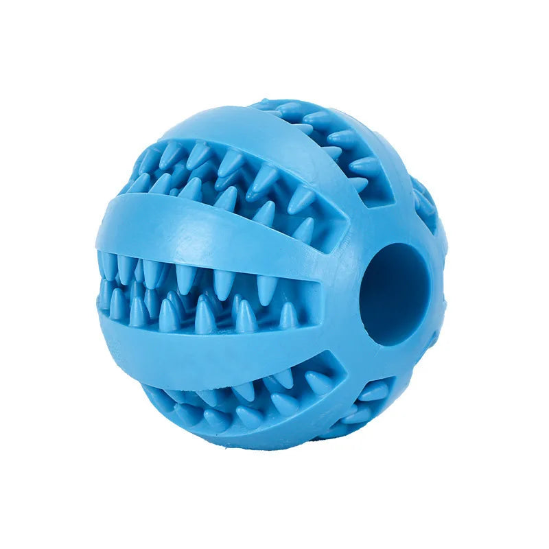 A light blue rubber ball with sharp spikes used as an interactive treat dispenser for dogs.
