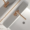 A brass diatomaceous earth absorbent mat is shown installed in a modern bathroom or kitchen sink.