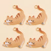 A set of four gold-colored cat pendant charms for jewelry making