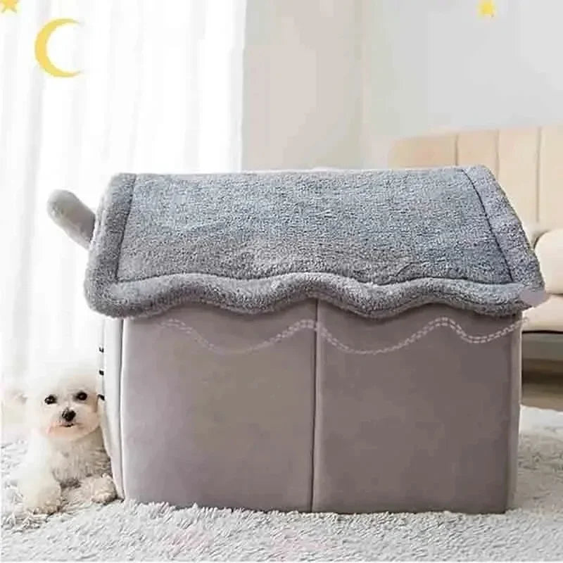 A gray removable dog house pet bed with a soft gray cover sits on a white fluffy rug.