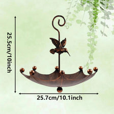 A dark bronze antique umbrella bird feeder with a curved metal spout and a shallow bath bowl.